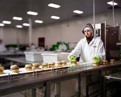 Sheetz - Worker preparing frozen egg biscuits at Sheetz factory. Commission for Fortune Magazine.